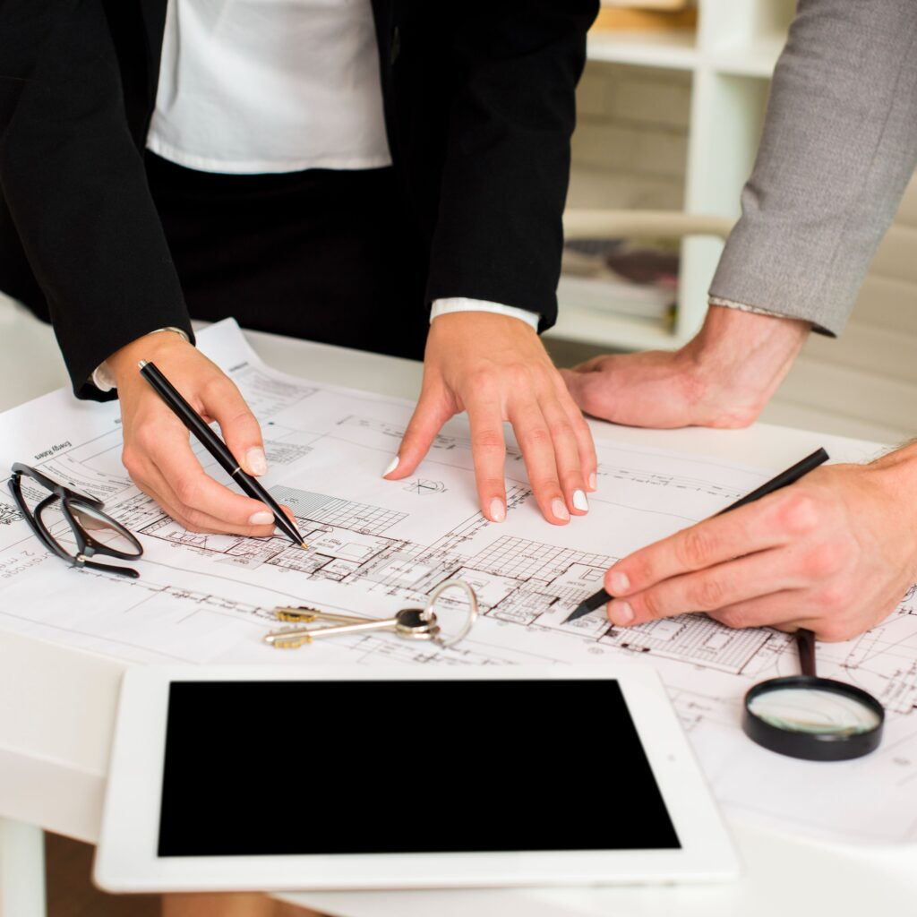 Our Services architects studying plan with mockup