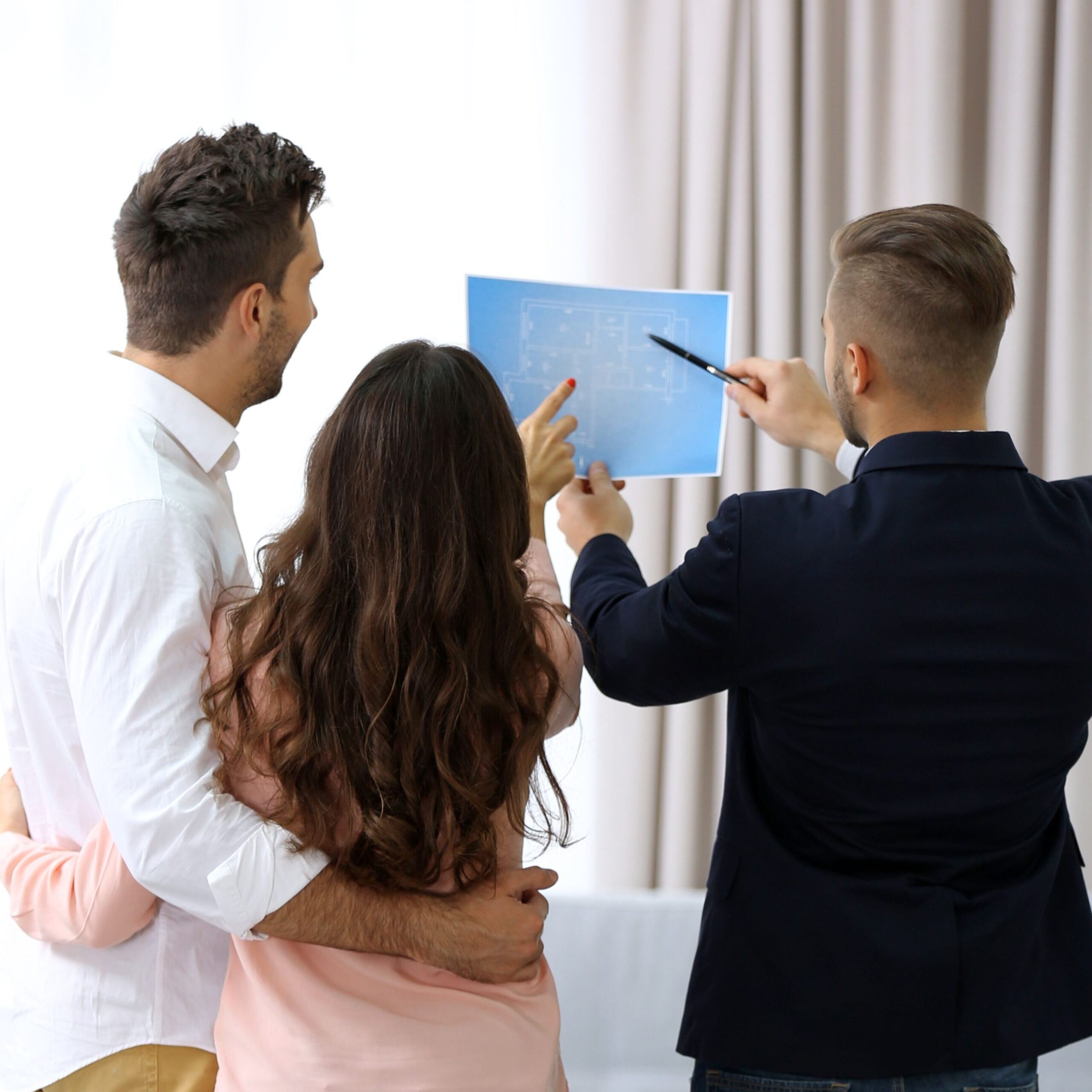 Our Services estate agent presenting new project happy couple light background
